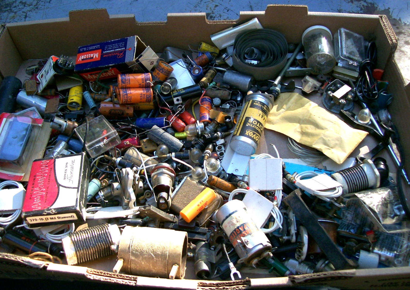 two boxes of miscellaneous radio parts