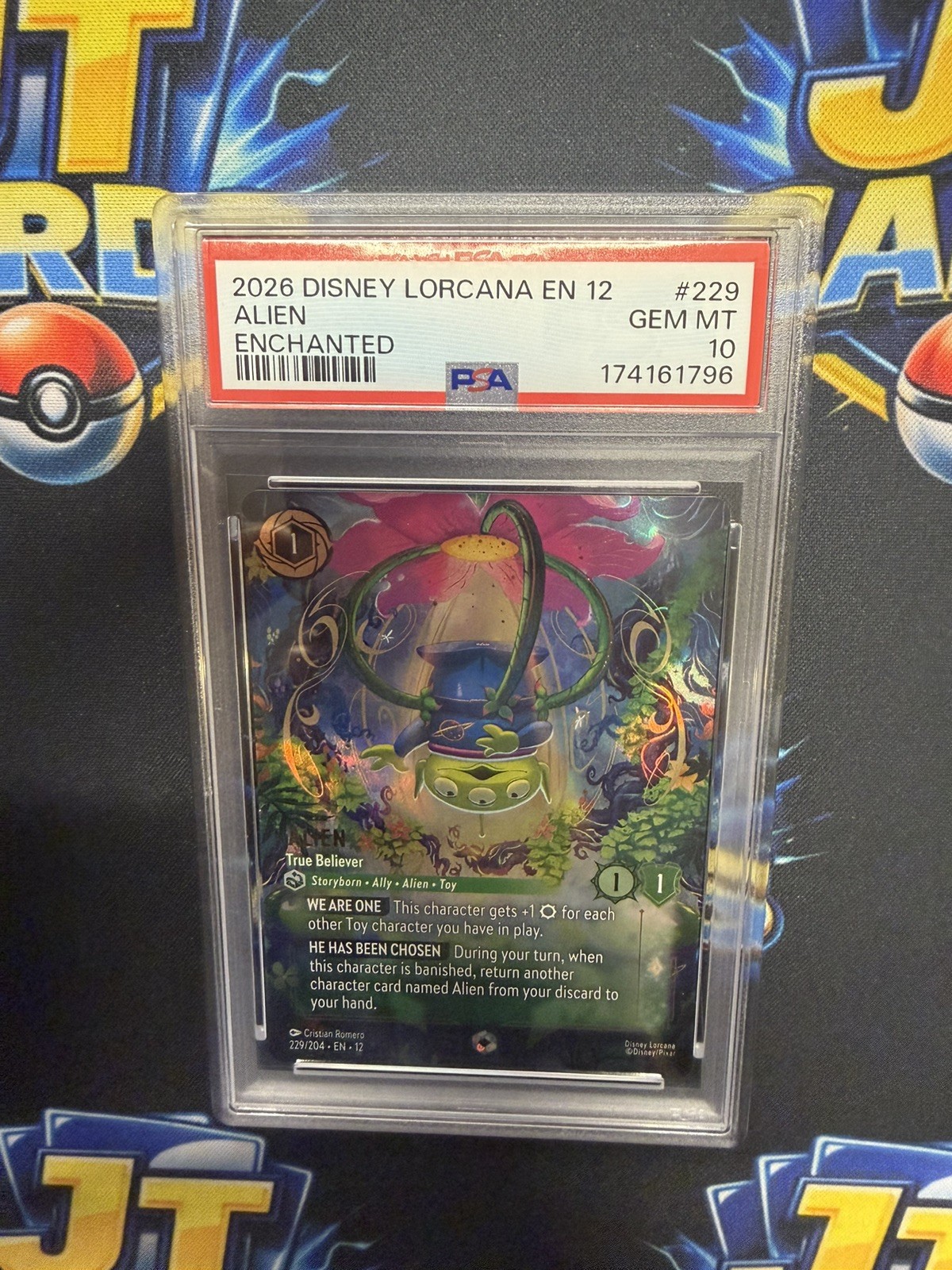 2026 DISNEY LORCANA EN 12-WILDS UNKNOWN ENCHANTED ALIEN - TRUE BELIEVER PSA 10