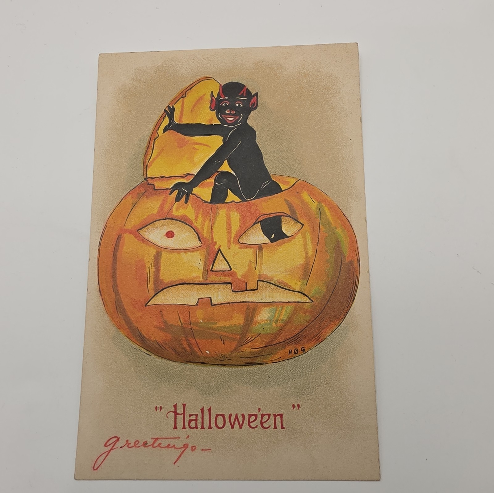 Antique Halloween Postcard Black devil Imp In Jack O Lantern Pumpkin 1910