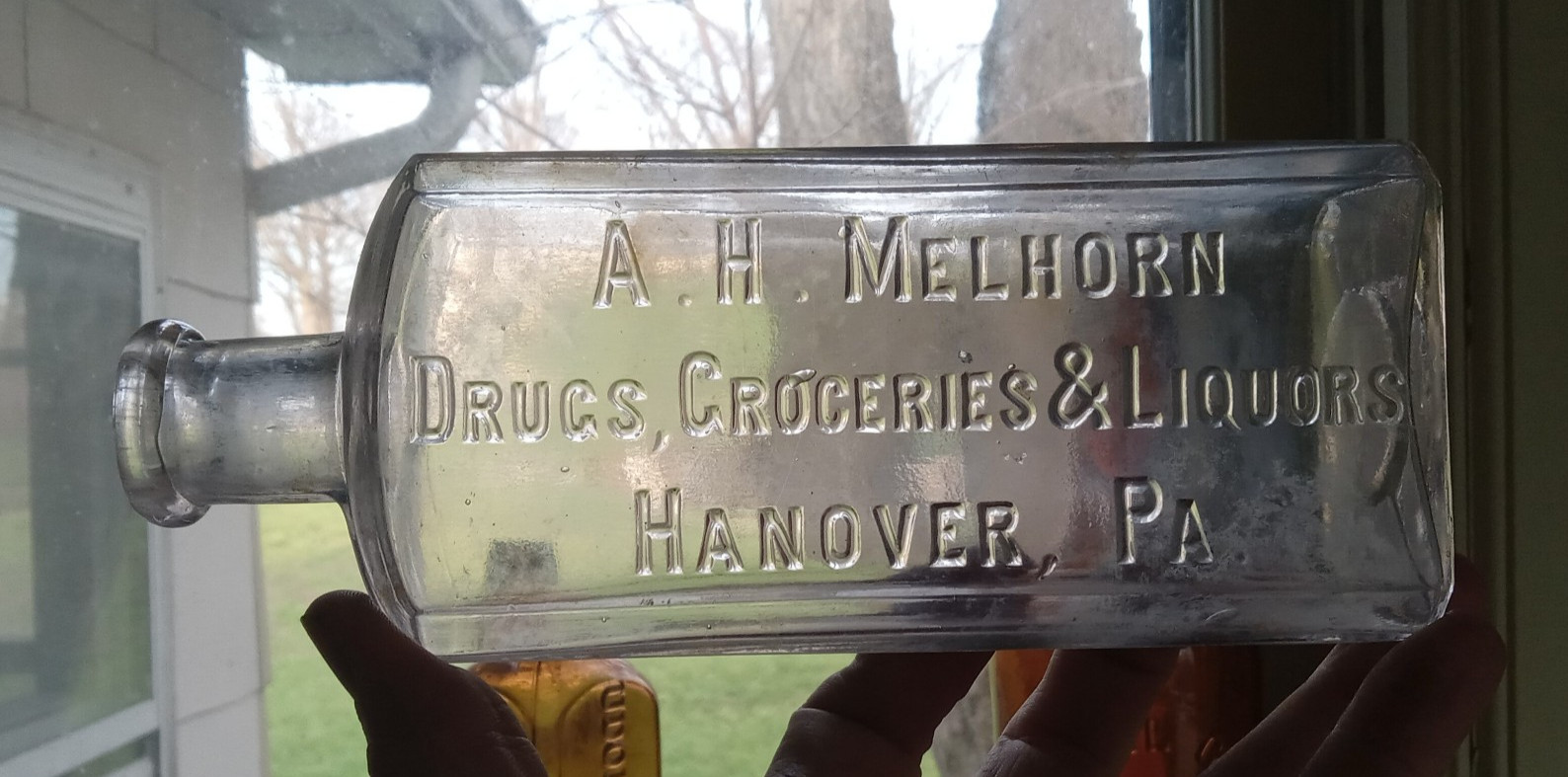HANOVER,PA A.H.MELHORN DRUGS GROCERIES & LIQUORS 1890 PANELED WHISKEY BOTTLE