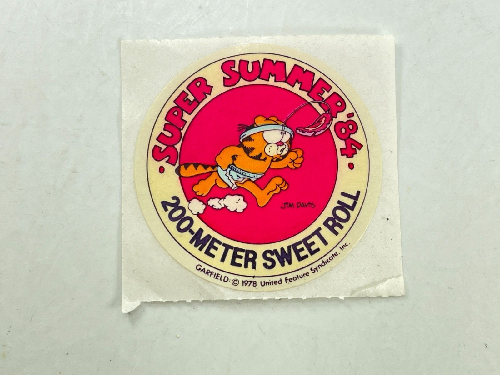 Vintage 1984 United Syndicate Garfield Summer Games Sticker 200-Meter Sweet Roll