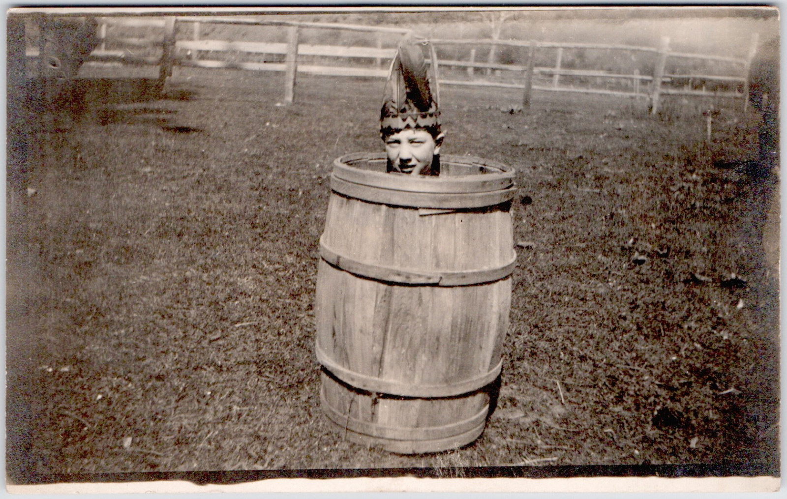 c1909 Child in Barrel Native Headdress RPPC Postcard Whimsical Fun Vintage