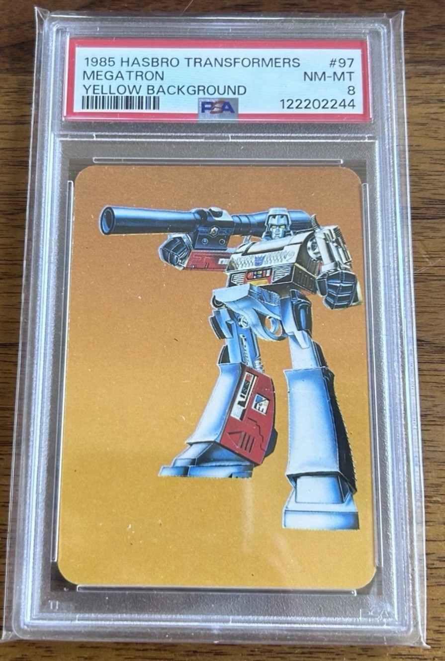 1985 HASBRO TRANSFORMERS #97 MEGATRON YELLOW BACKGROUND PSA 8