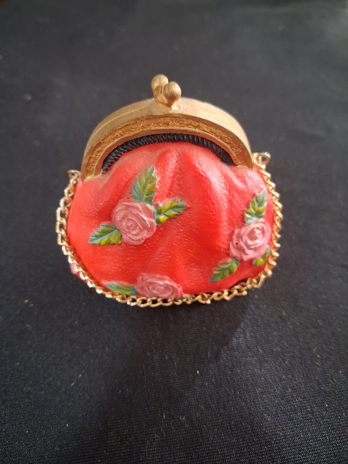Vintage miniature resin coin purse features gold chain and painted roses