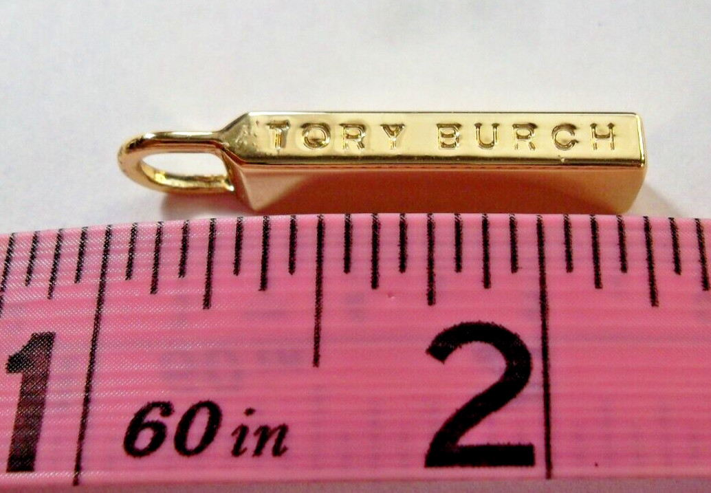TORY BURCH replacement handbag zipper pull gold tone , 1  1/4 x 1/4 inches