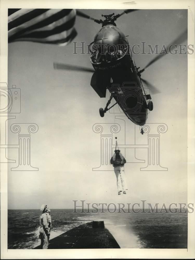 1955 Press Photo John Davis Lodge lifted by Naval Helicopter during training