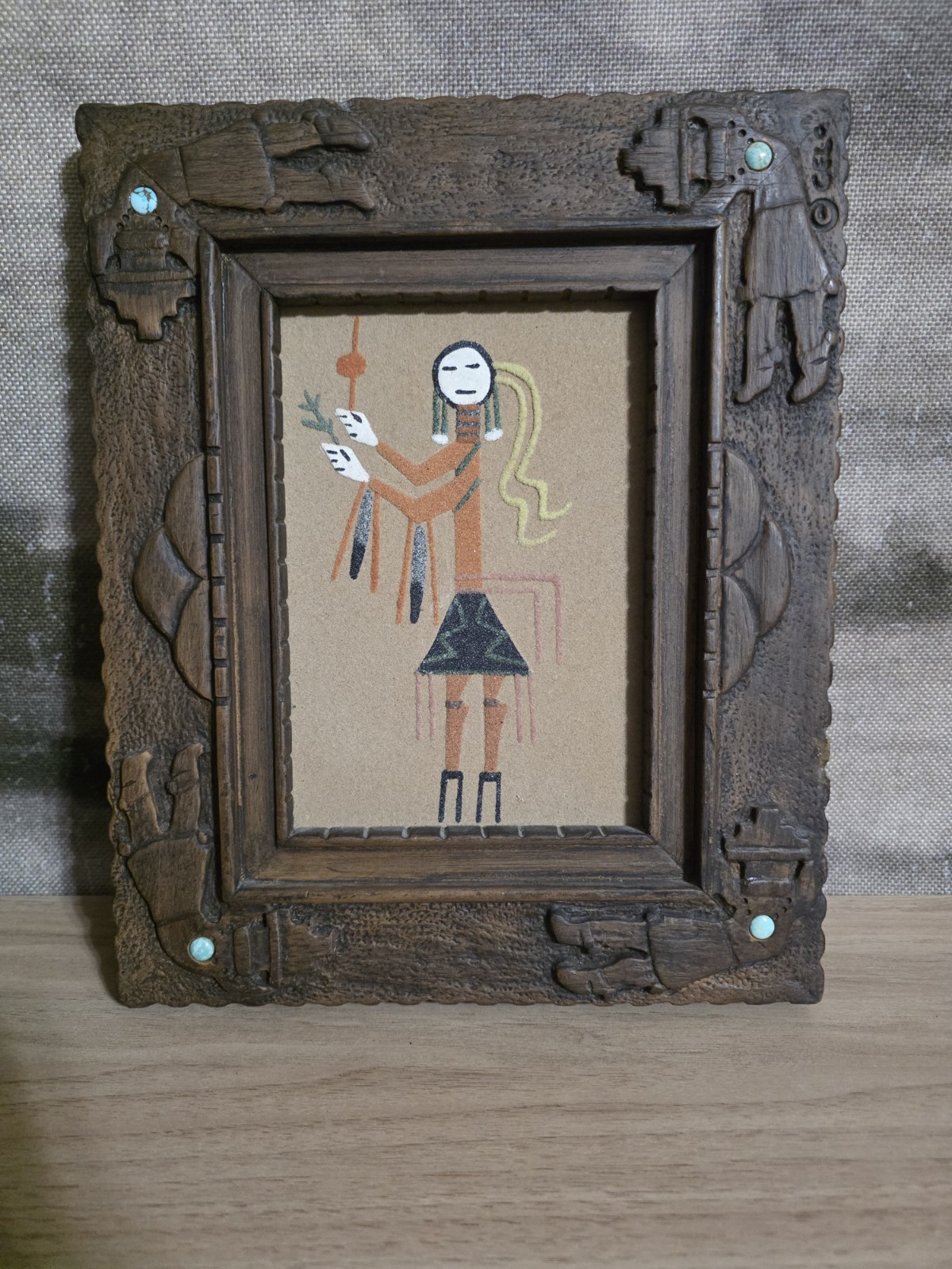 Navajo sand art painting. Frame with turquoise stones. Sand Art collection.