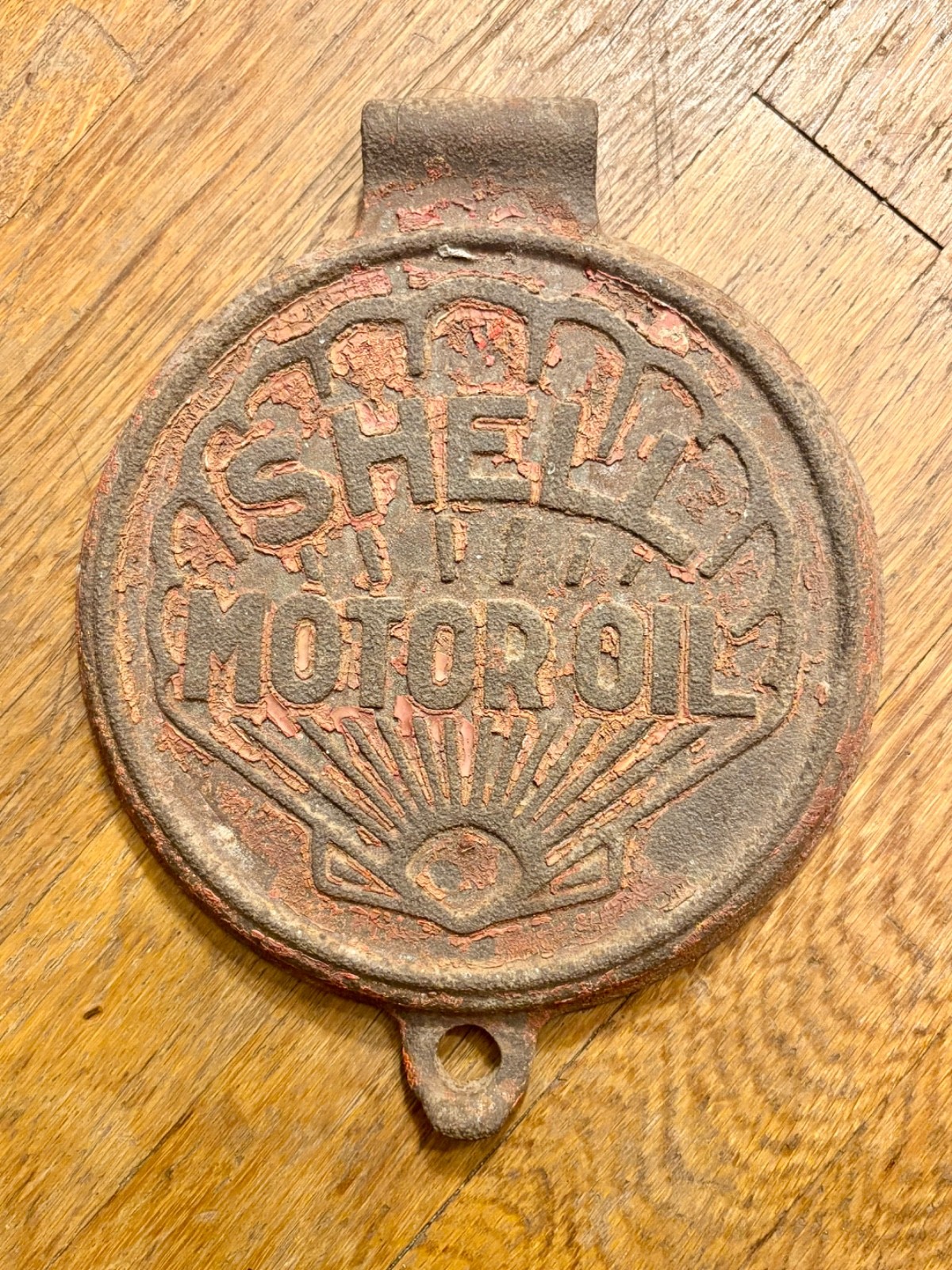 Vintage cast-iron Shell Motor Oil lubester lid