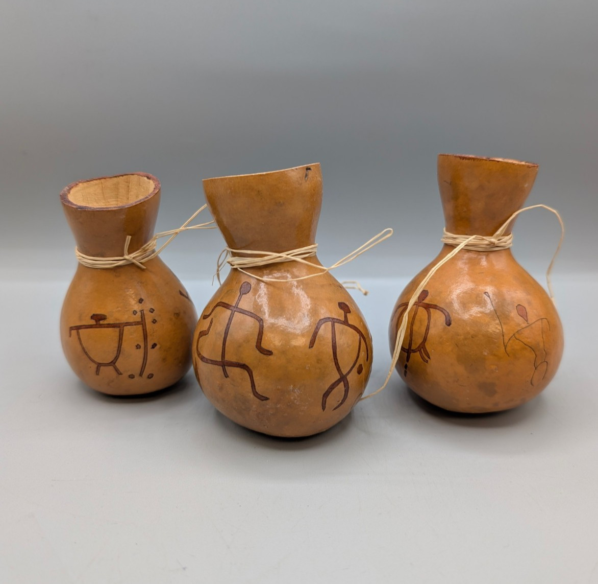 Set of three SMALL Vintage African hand-decorated Calabash gourd vessels