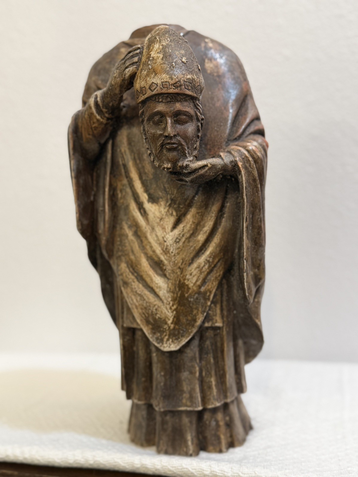 VINTAGE HAND CARVED WOOD SANTOS DEPICTING SAINT FIRMIN HOLDING HIS HEAD