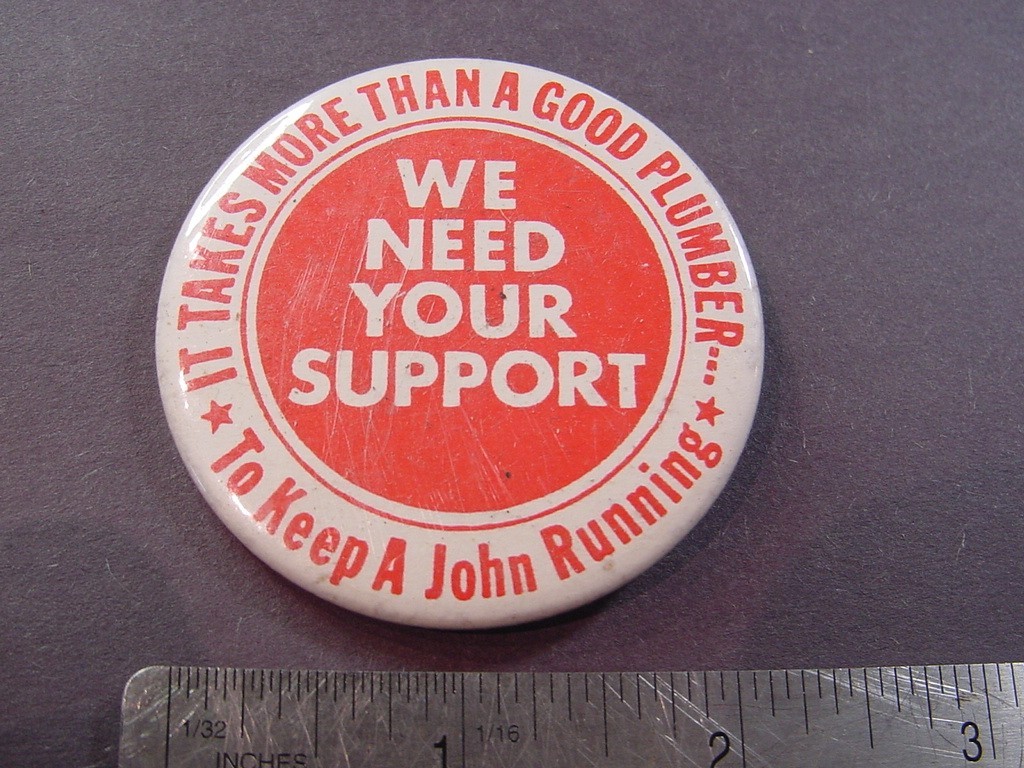 VTG BUTTON - IT TAKES MORE THAN A GOOD PLUMBER TO KEEP JOHN RUNNING
