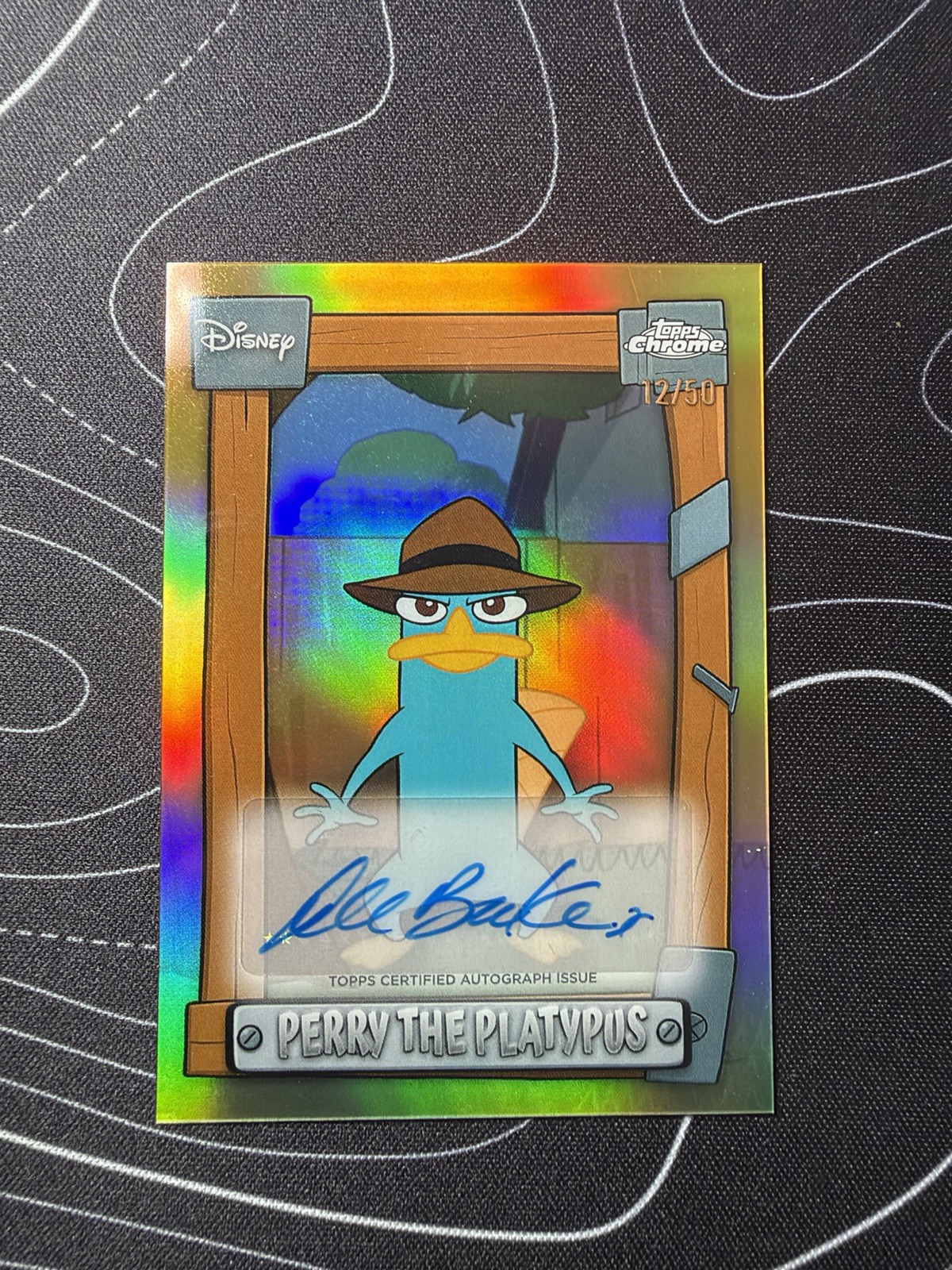 2026 Topps Disney Neon Perry Platypus Dee Bradley Baker Gold Auto 09/50