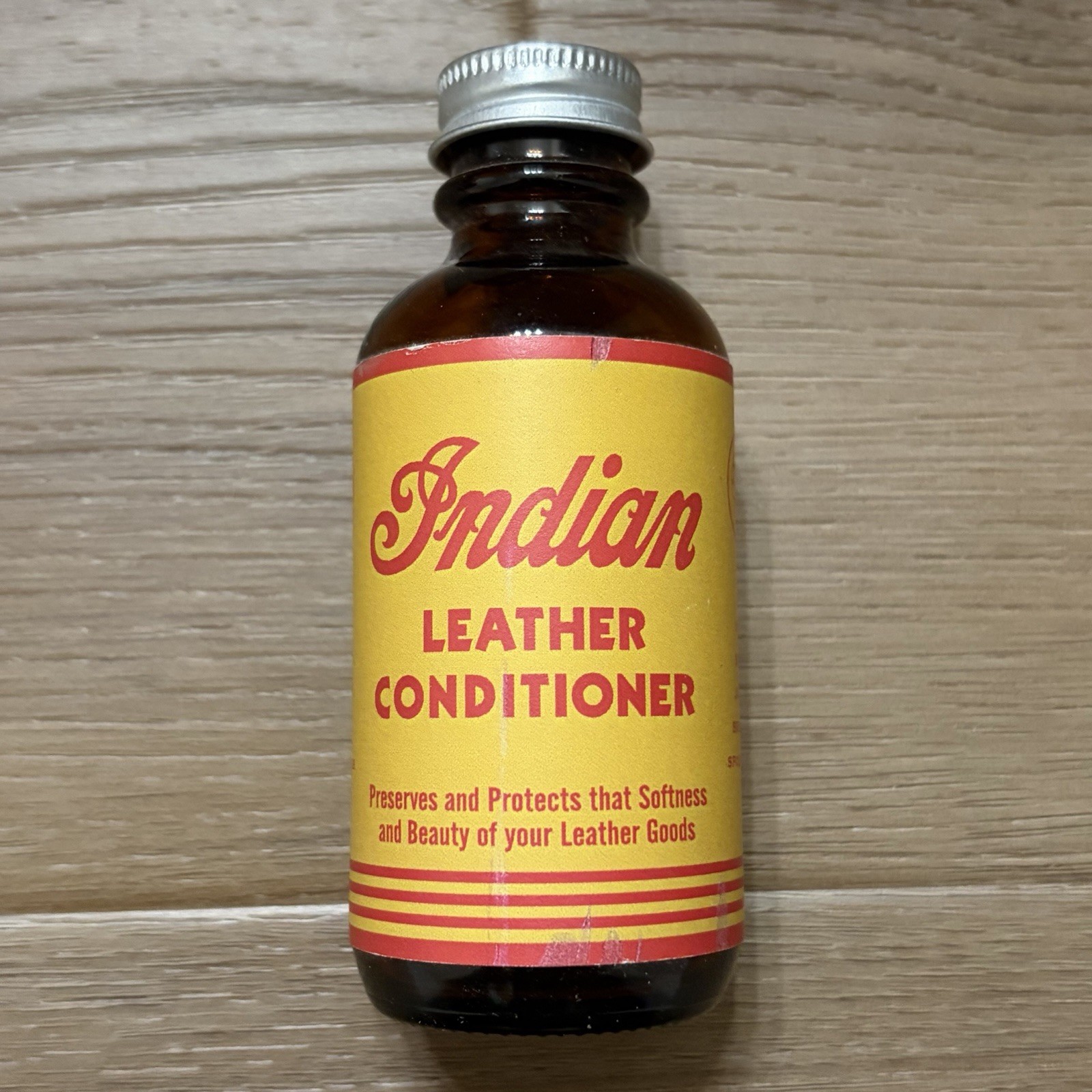 ⁠Vintage Indian Motorcycle Leather Conditioner Bottle Amber Glass Advertising