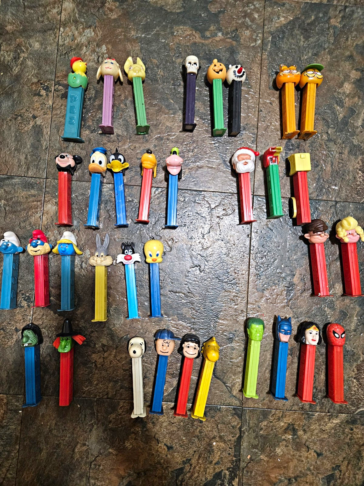 Lot of 34  PEZ Dispensers Cartoon Characters Disney Warner Bros Snoopy Garfield