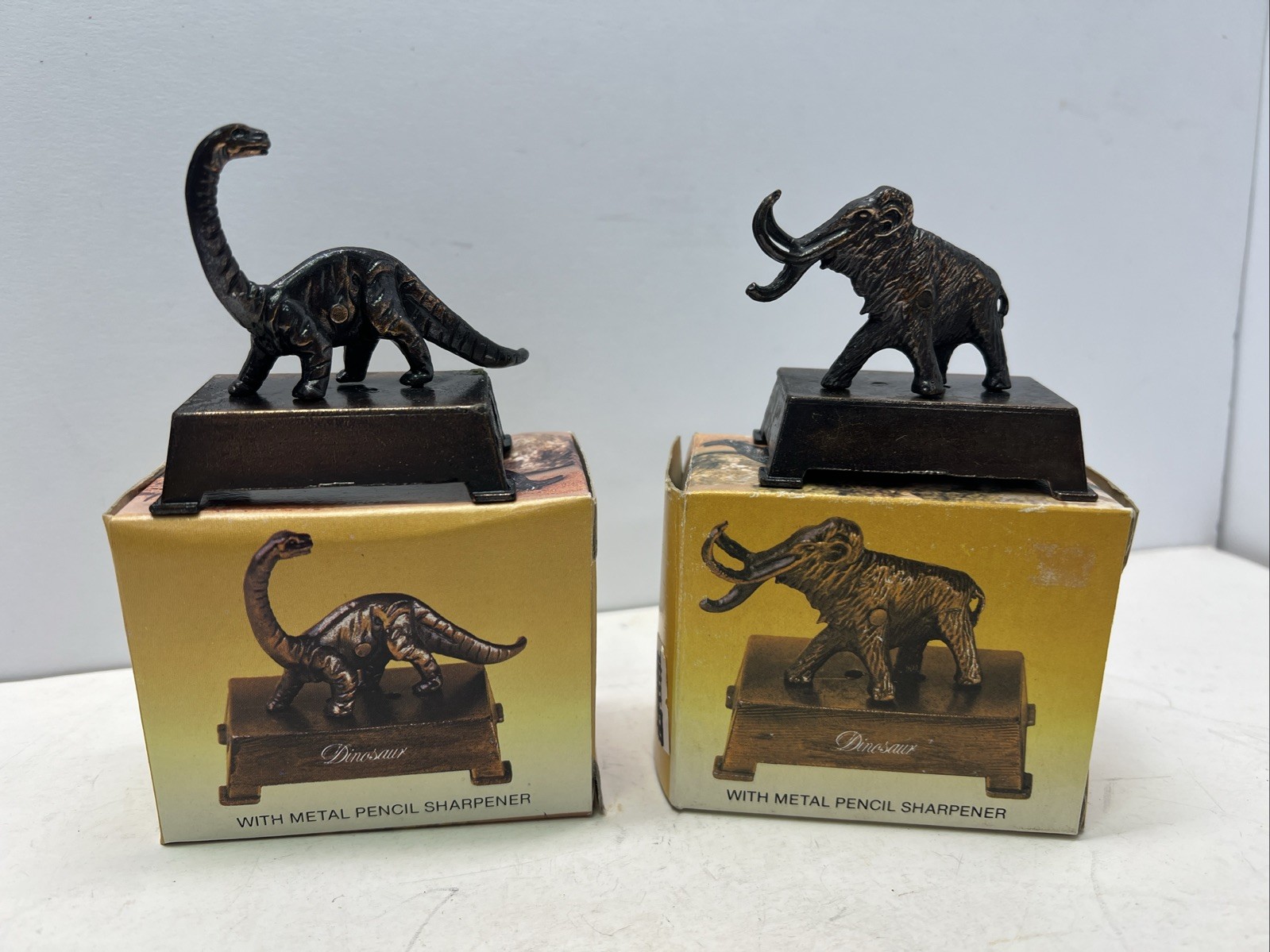 Two (2) VTG NOS Metal Dinosaur Pencil Sharpeners W/ Boxes 