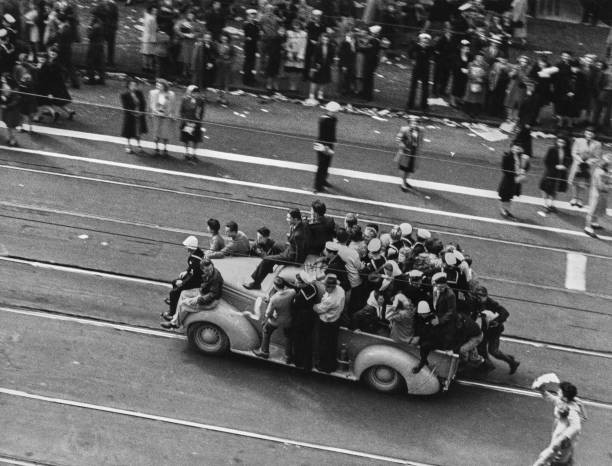 High angle view revellers including naval officers standing runnin- Old Photo